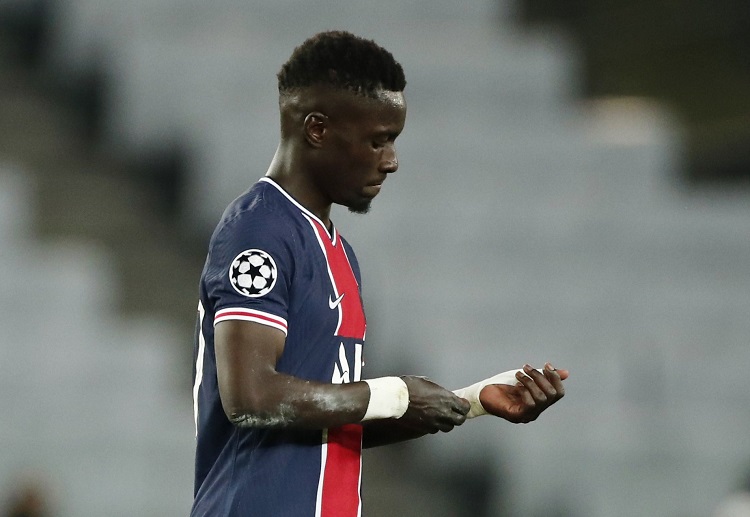 Idrissa Gueye looks dejected after receiving a red card during the Champions League semi-finals