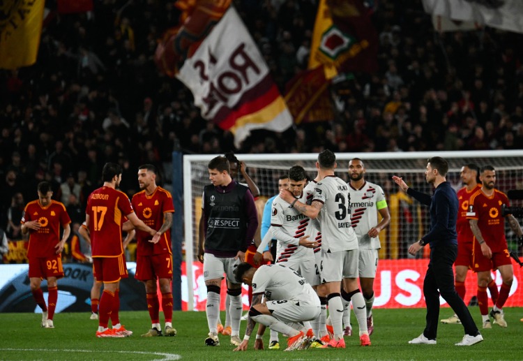 Bayer Leverkusen players congratulate each other after winning 0-2 the Europa League semi final first leg vs Roma